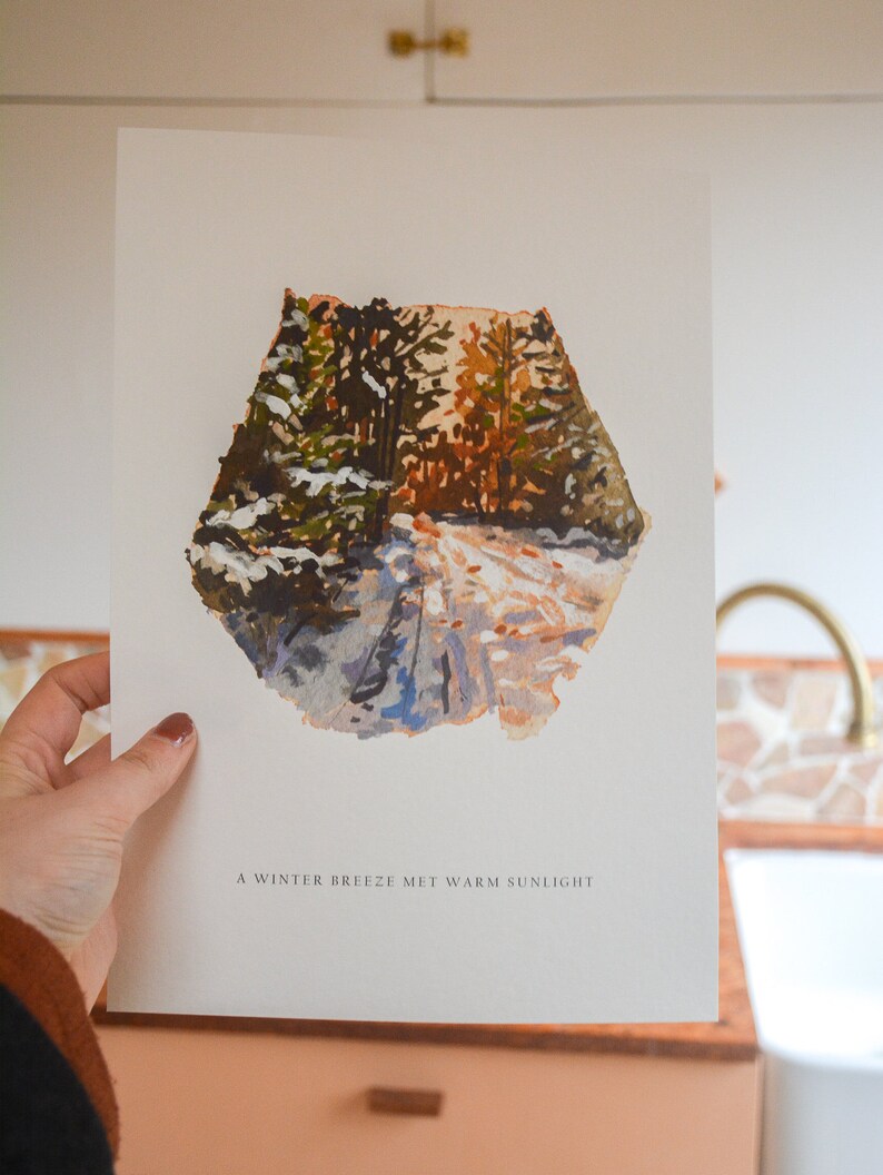 May include: A watercolor painting of a snowy forest path with warm sunlight filtering through the trees. The text "A winter breeze met warm sunlight" is printed below the image.