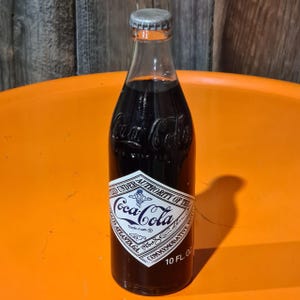 Coca Cola Commemorative 10 fl oz Bottle with Contents
