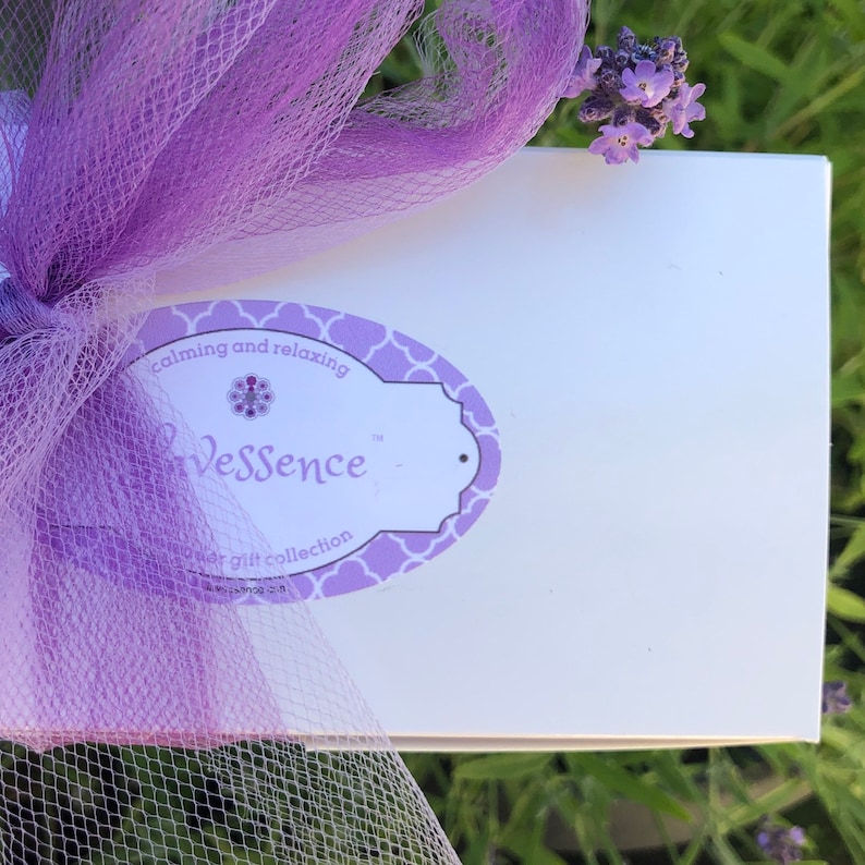 White gift box with purple tulle bow and Lavessence lavender bath and body gift set logo