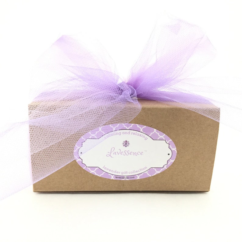 Brown kraft box with purple tulle bow and Lavessence lavender bath and body gift set logo