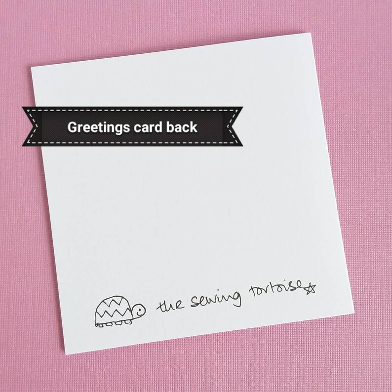 May include: The back of a white greeting card with a black and white illustration of a turtle and the text "the sewing tortoise".