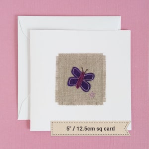 May include: A purple butterfly embroidered on a square piece of burlap fabric, mounted on a white card with a brown label that reads "5"/ 12.5cm sq card".