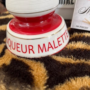 Bonnecaze Baton Rouge, LA Liqueur Malette match striker red and white, no box