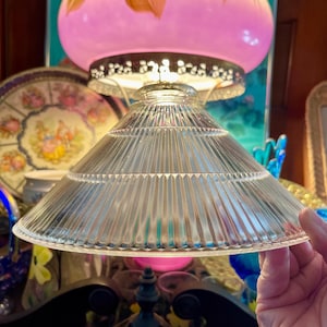 May include: A set of three ceramic mugs with a speckled, matte finish. The mugs are in shades of cream, light brown, and dark brown. Each mug has a simple, minimalist design, perfect for coffee or tea.