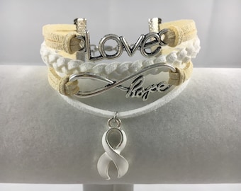 Adoption, Blindness, Bone Cancer, Hernia, Lung Cancer, Mesothelioma, Scoliosis White and Tan Suede Multi-Strand Awareness Bracelet