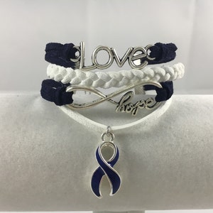 ARDS, Anal Cancer, Arthritis, Colitis, Colon Cancer, Dystonia, Huntington's Disease, Blue and White Suede Multi-Strand Awareness Bracelet imagen 1