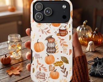 May include: A white smartphone case featuring a repeating pattern of orange pumpkins, autumn leaves, a mug labeled Pumpkin Spice, and text including Fall is my favorite, Stay Cozy, and Fall Vibes, with a black camera module at the top.