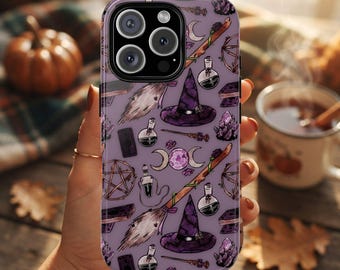 May include: A purple smartphone case featuring a repeating pattern of witch-themed illustrations including pointed hats, broomsticks, potion bottles, crystals, pentagrams, books, wands, and triple moon symbols with a central purple patterned moon.