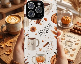 May include: A white smartphone case featuring a repeating pattern of coffee mugs, orange pumpkins, cinnamon sticks, and autumn leaves. The design includes various mug styles, some with striped textures and others with floral accents, scattered across the surface.