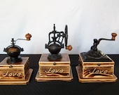 Coffee Grinders, choose from 3 Antique styled burnt -Pine wood with Java engraving, cast iron body with a ceramic mechanism and hinge top.