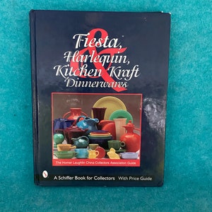 May include: A blue book titled "Fiesta, Harlequin, Kitchen Kraft Dinnerwares" with a colorful image of Fiestaware on the cover. The book is a guide for collectors of Homer Laughlin China.