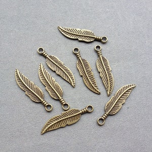 100 pcs 8x29mm of Antique Bronze Leaf Pendants Charms