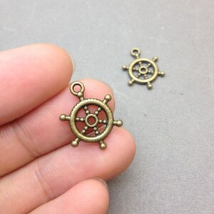 100 pcs of Antique Bronze Rudder Charms 17x20mm