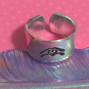 Love / I love you.  Hands making a heart  cuff ring