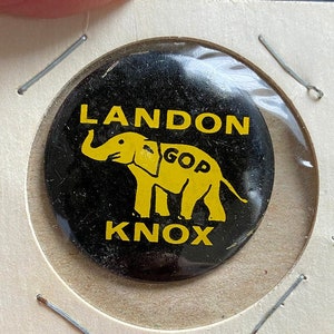 May include: A black and yellow political button with an elephant and the text "LANDON KNOX GOP".