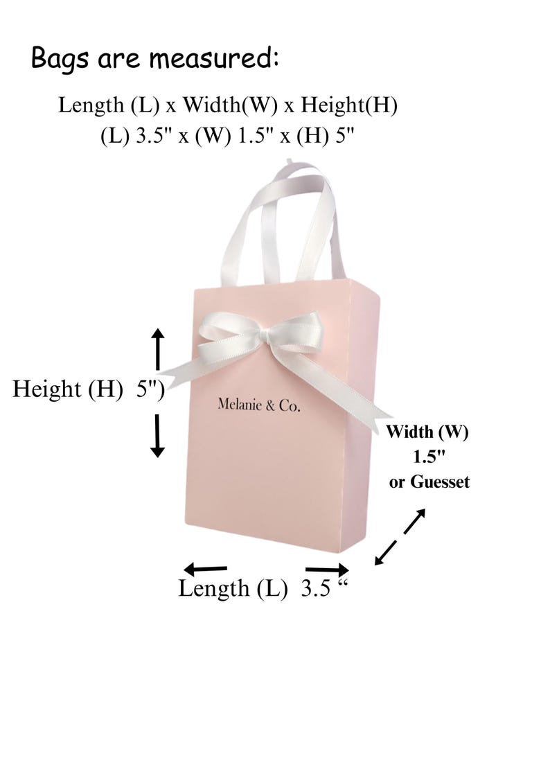 May include: A pink gift bag with a white ribbon and bow. The bag has a white handle and the text "Melanie & Co." printed on the front. The bag measures 3.5 inches long, 1.5 inches wide, and 5 inches high.