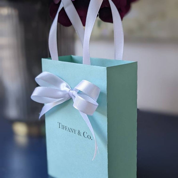 Breakfast at Tiffany favor bags. Elegant Bags for guests with satin ribbon handles and custom name