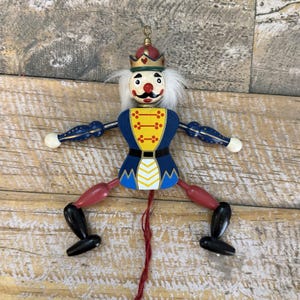 Vintage Nutcracker Jumping Jack Ornament Christmas Toy Soldier Pull String 7”