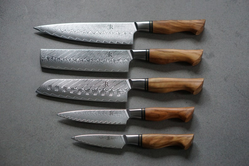 Santoku knife, Chef knife, Damascus knife, Handmade knife, Nakiri Knife, Utility knife. 
Olive wood handle, Ryda knives, ST650 powder steel, Kai knives, Miyabi knives, Global knives, Zwilling chef knife, 5 star knife, Crafted kitchen knives.