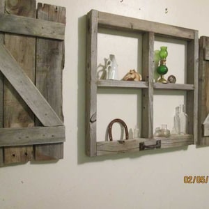 Rustic little window frame with shutters