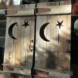 Rustic shutters outhouse door