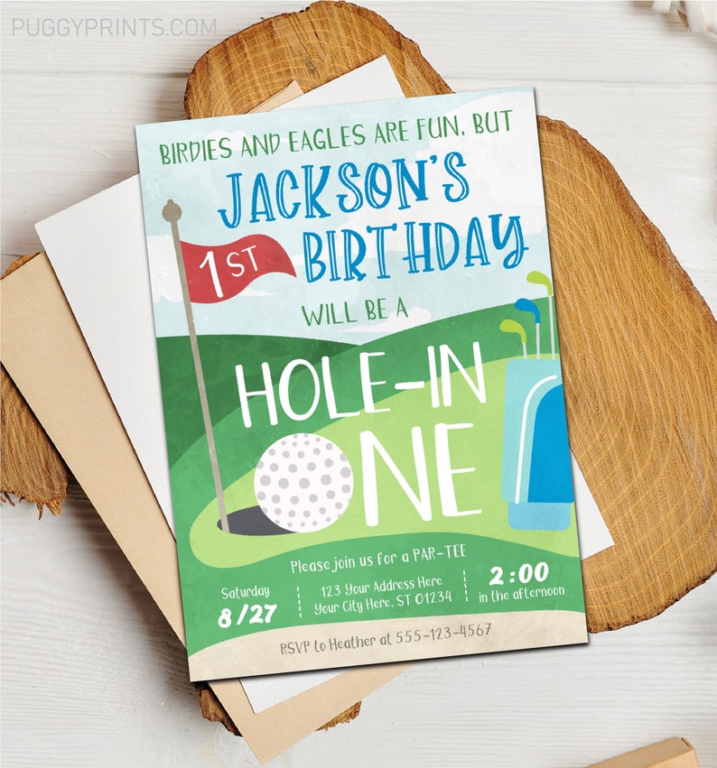May include: A golf-themed birthday invitation for a 1st birthday party. The invitation features a green golf course with a golf ball in the hole, a golf bag, and a flag. The text on the invitation reads "Birdies and Eagles are fun, but Jackson's 1st Birthday will be a Hole-in-One". The invitation also includes the date, time, and RSVP information.
