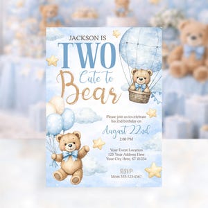May include: A light blue birthday invitation with a teddy bear theme. The invitation reads "Jackson is Two Cute to Bear" with details for the party on August 22nd. The design includes a teddy bear in a hot air balloon and holding balloons.