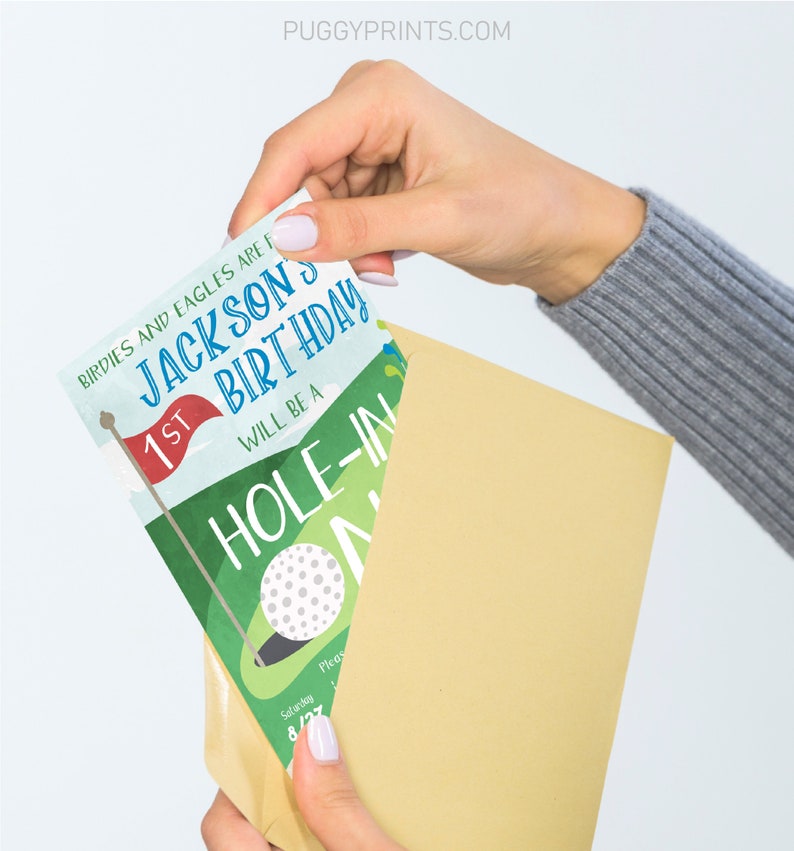 May include: A golf-themed birthday invitation with a green and blue colour scheme. The invitation features a golf ball, a golf flag, and the text "Birdies and Eagles are for Jacksons 1st Birthday Will be a Hole-in-One".