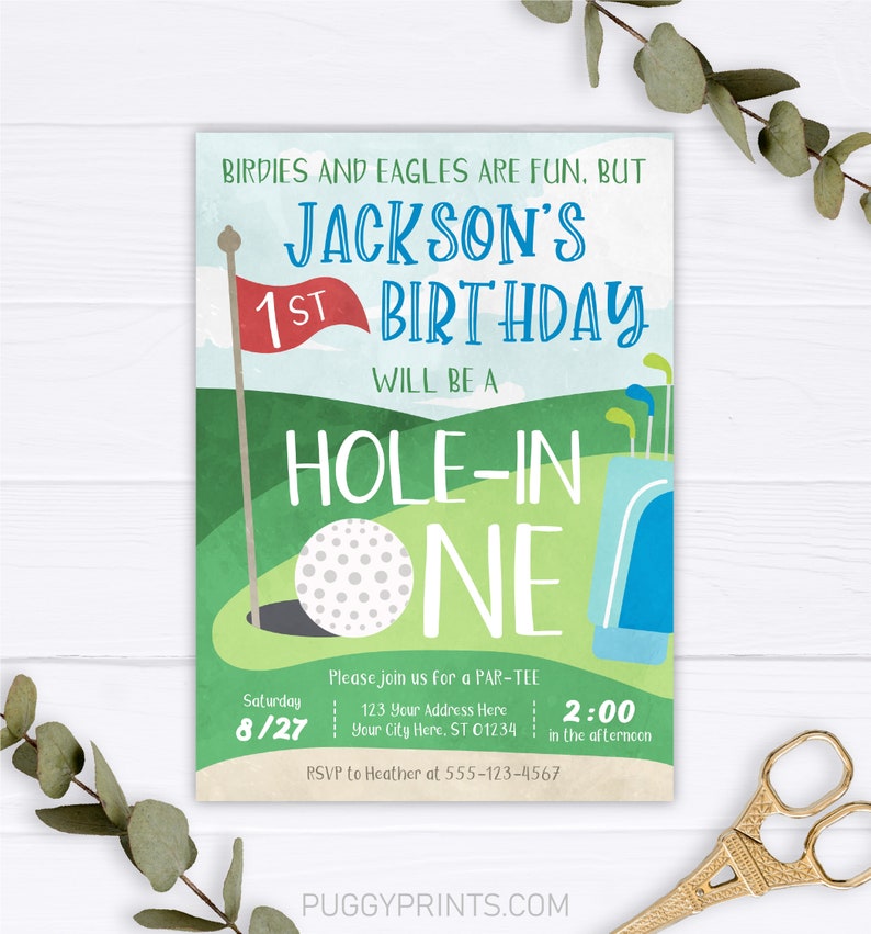 May include: A green and blue golf-themed birthday invitation for a 1st birthday party. The invitation says "Jackson's 1st Birthday Will Be A Hole-In-One". The invitation includes a golf ball, a golf bag, and a golf flag. The date of the party is Saturday 8/27 and the time is 2:00 in the afternoon. The invitation also includes the address and RSVP information.