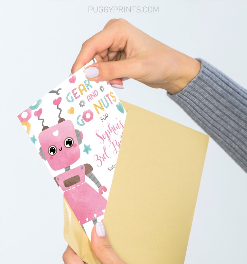 May include: A pink robot with a heart on its chest and a pink dress. The robot is surrounded by colorful gears, nuts, and bolts. The text "Gear and Go Nuts" is written in pink and yellow. The text "For Sophia's 3rd Birthday" is written in pink and blue.