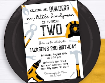 May include: A white and yellow birthday invitation with a black and white illustration of tools. The text reads "Calling all builders our little handyman is turning two. Join us to celebrate Jackson's 2nd birthday. Saturday, August 15th at 2:00 pm. Jackson's Tool Shed 123 Your Address Here Your City Here, ST 01234. Please reply to Mour 555-123-4567."