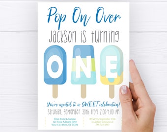 May include: A blue and yellow popsicle-themed first birthday party invitation with the text "Pop On Over Jackson is turning ONE" and details for the party, including the date, time, and RSVP information.