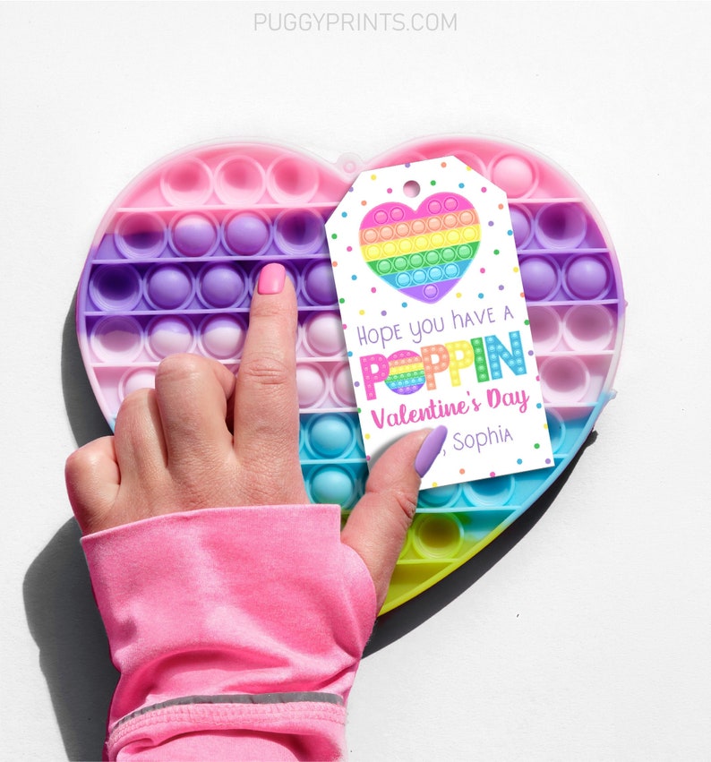 May include: A white gift tag with colorful rainbow pop it design and the text "Hope you have a POPPIN Valentine's Day, Sophia".