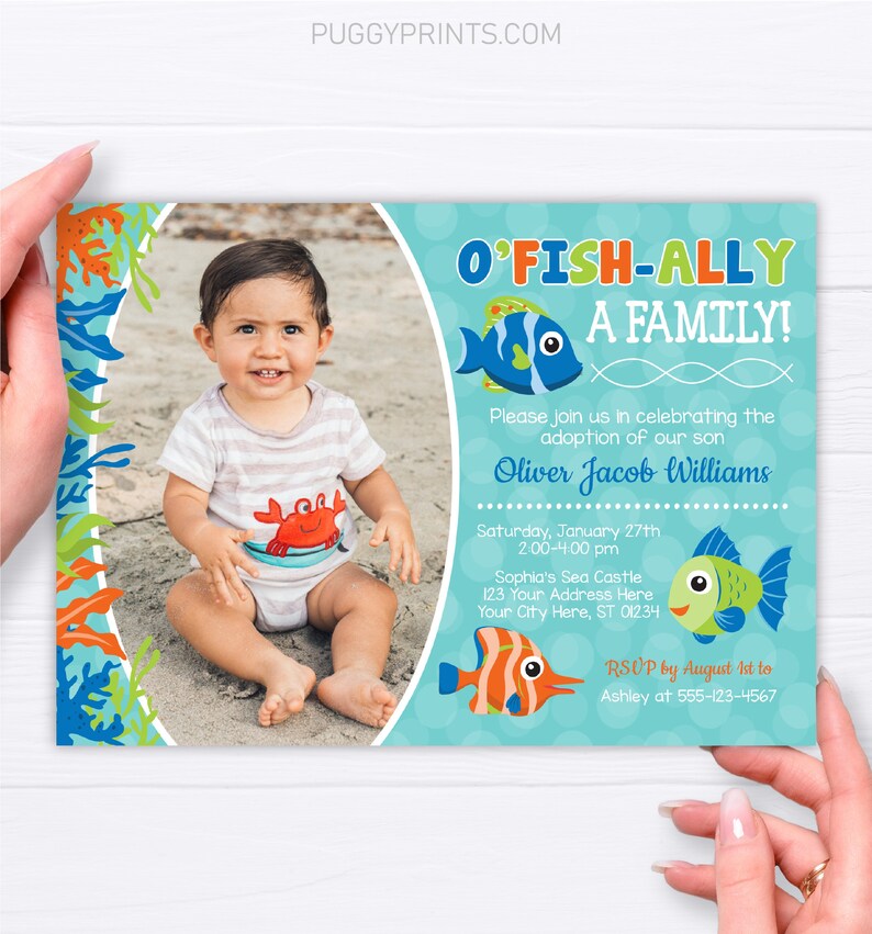 May include: A blue and green invitation with a photo of a baby boy in a red and orange crab onesie. The invitation says "O'Fish-Ally A Family!" and includes the text "Please join us in celebrating the adoption of our son Oliver Jacob Williams" and details for the event.
