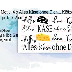 Op de afbeelding: Een witte sticker met de tekst "Alles Käse ohne Dich!" en kaasillustraties. De sticker meet 15 x 2 cm. De tekst "Rub On Sticker" is ook aanwezig, samen met instructies voor gebruik.