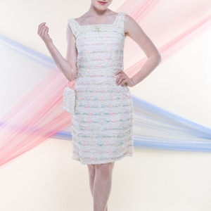 MAE (Size 4-6): Knee length white and ivory lace shift dress with speckles of color, small bow, and lace fold back detail.