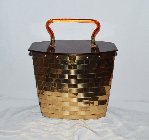 Lavish Maiden Vintage on Etsy - Vintage Etra Gold Cage Handbag Box Purse,  Circa 1950's, Shiny Gold Patent Leather Purse, Mid Century Fashion  https://etsy.me/2Px0pI6 #bagsandpurses #clutch #gold #etra #cagepurse  #cagehandbag #boxpurse #1950sgoldpurse #