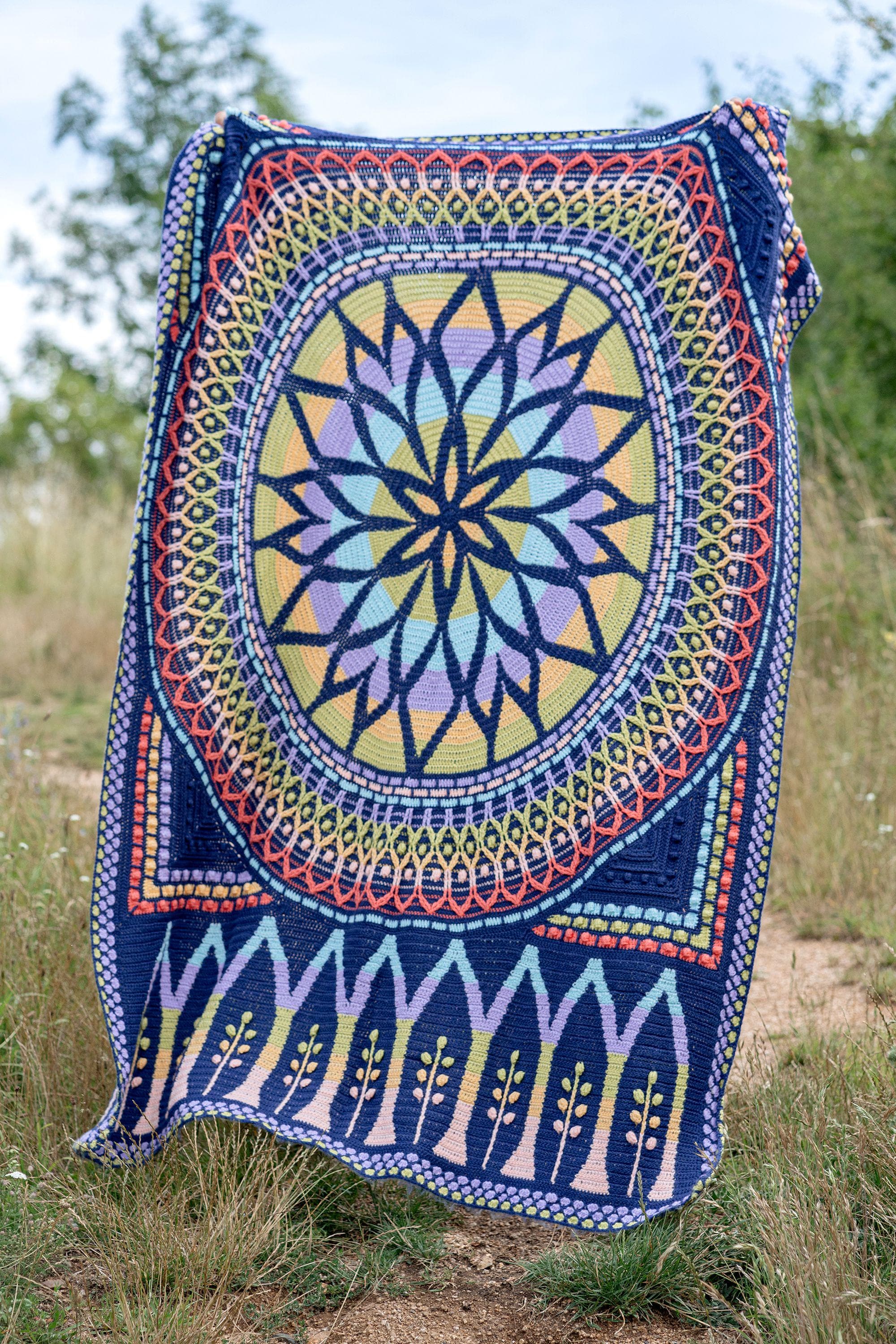 20 Mandala Blanket Crochet Patterns for Round, Square, and Star-Inspired Throws 16 Rozeta Blanket Crochet Pattern: Tapestry Mandala