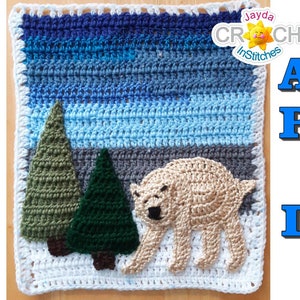 May include: A crocheted square with a winter scene featuring a polar bear, two trees, and a blue and white sky. The text "Applique Patterns Not Included" is written in blue letters on a white background.