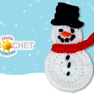 May include: A white crocheted snowman with a black top hat and red scarf. The snowman has black eyes, a black mouth, and an orange nose. The snowman is standing in front of a blue background with white snowflakes.