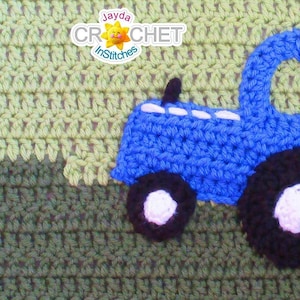 May include: A blue crocheted tractor with black wheels and white accents is on a green crocheted background. The text "Jayda CROCHET InStitches" is in the top left corner of the image.