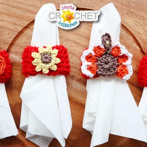 May include: Four crocheted napkin rings in fall colors. The rings feature a sunflower, a pumpkin, a turkey, and a leaf.
