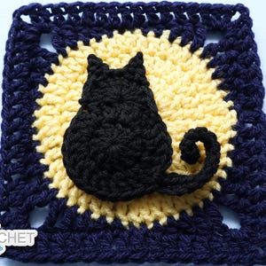 May include: A square crochet granny square featuring a yellow circular center and a dark blue border. A black crocheted cat silhouette is centered on the yellow circle. The text Jayda InStitches is printed in the bottom left corner.
