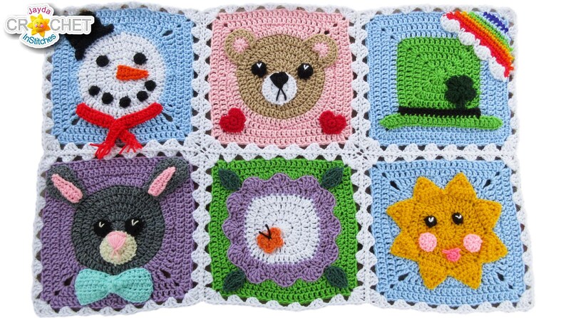 May include: A crochet blanket with six colorful squares featuring different animal and nature designs. The squares include a snowman, a bear, a leprechaun hat, a bunny, a flower, and a sun.