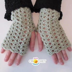 May include: A pair of light green crocheted fingerless gloves with a lacy pattern.