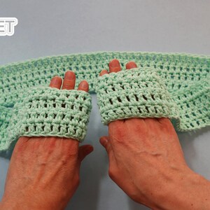 May include: A light green crocheted headband with two matching crocheted wrist warmers. The headband and wrist warmers are made with a simple stitch pattern.