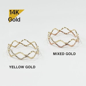 May include: Three 14K gold rings with a wavy, woven design. The rings are shown in yellow gold, rose gold, and mixed gold.