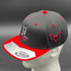 May include: Black and red baseball cap with a white embroidered logo of a bat and the text "Flexfit Tech 110 One Ten" on the underside of the brim.