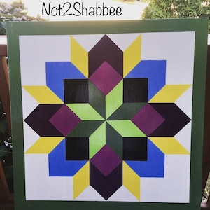 Not2Shabbee has Barn Quilts! Hand Painted Made to Order Starburst Pattern Barn Quilt 24” x 24” Wood Barn Quilt on outdoor sign board.