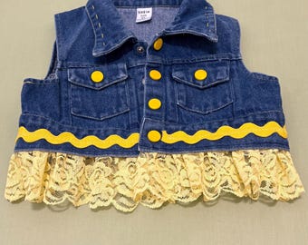 Child’s Denim vest Embellished with embroidered flowers and lace.